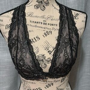 Out from under shimmery black bralette